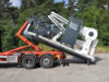 Aufladen einer transportablen Walzenpresse mit Abrollkipper