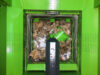 Foto Packstation PS1400 MAX mit vergrößerter Öffnung während Walzvorgang von oben